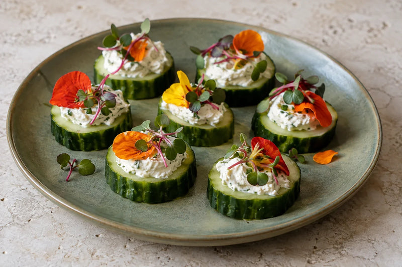 AI-generated serving illustration: Nasturtium Cream Cheese Cucumber Bites with red radish microgreens
