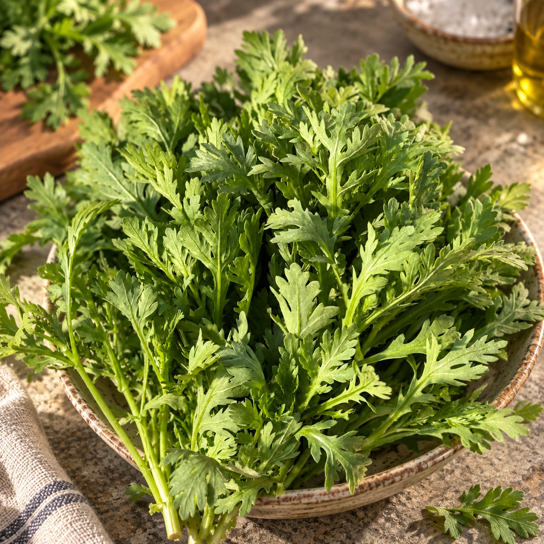 Shungiku edible chrysanthemum greens in a kitchen bowl