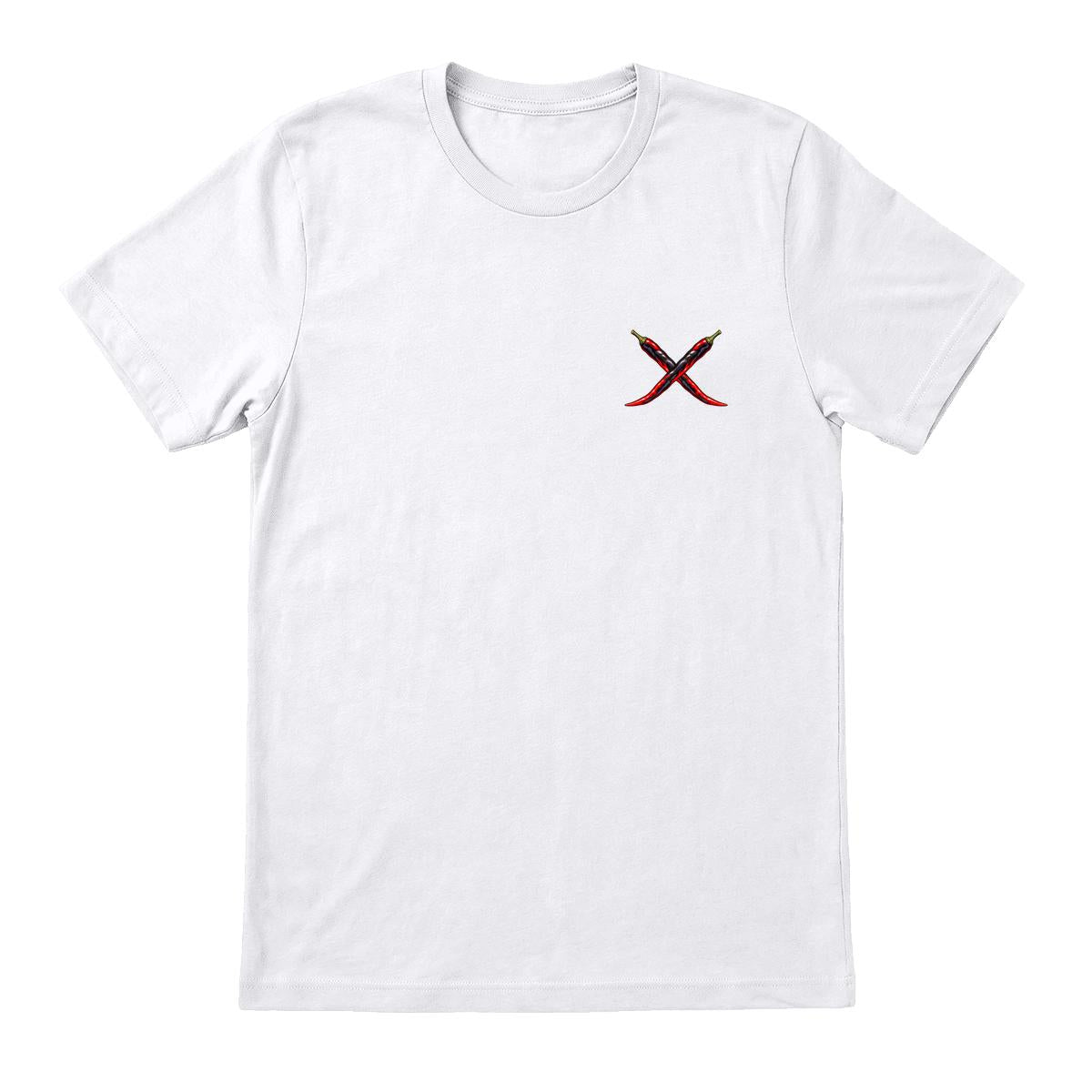 Casa Verde Seeds T-shirt front: small crossed dark chilies with red accents on the left chest of a white Bella+Canvas 3001. Native Printeez mockup; draft garment candidate.