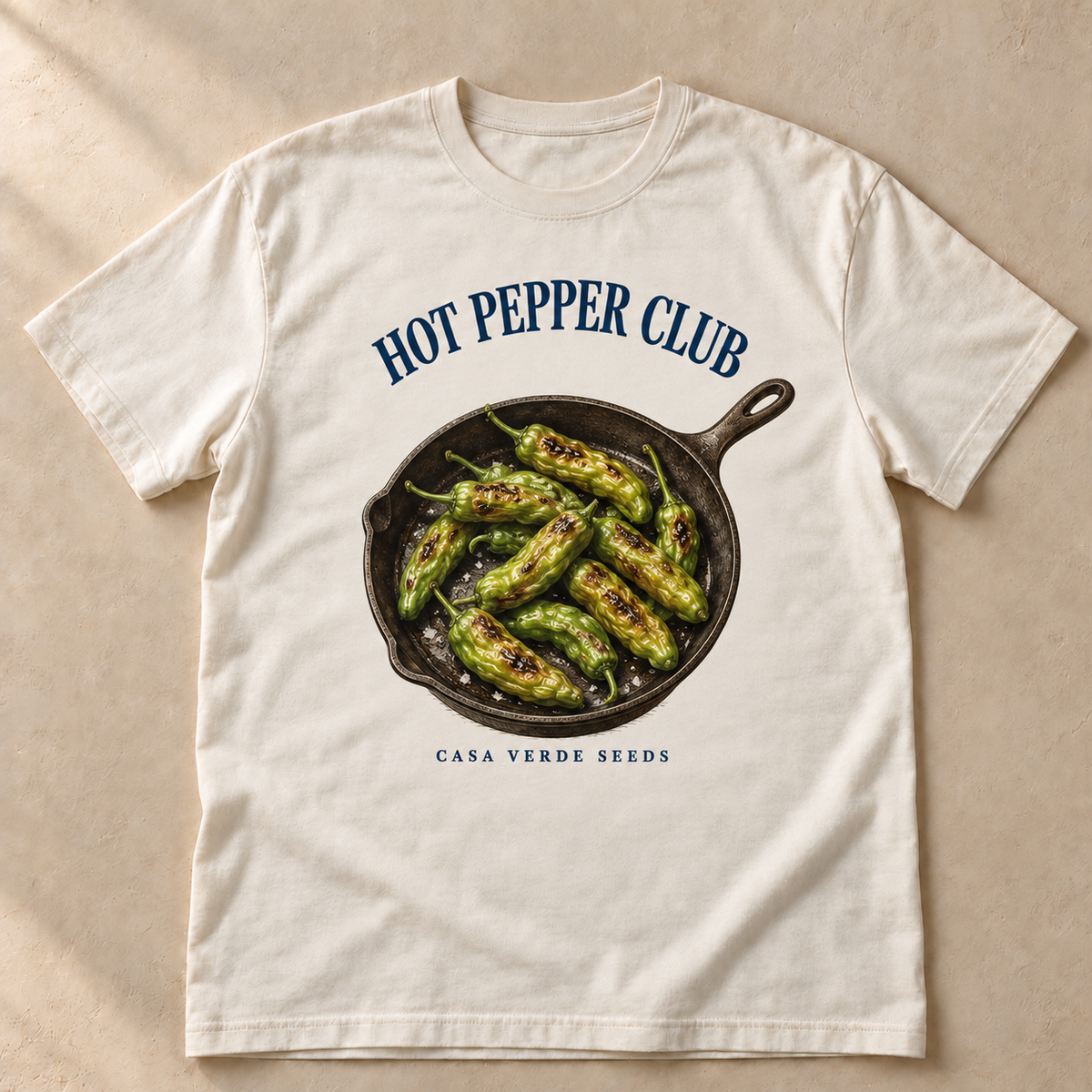 Hot Pepper Club T-Shirt — individual shirt front showing the approved painted shishito skillet design. Illustrative preview, not a physical sample or production proof.