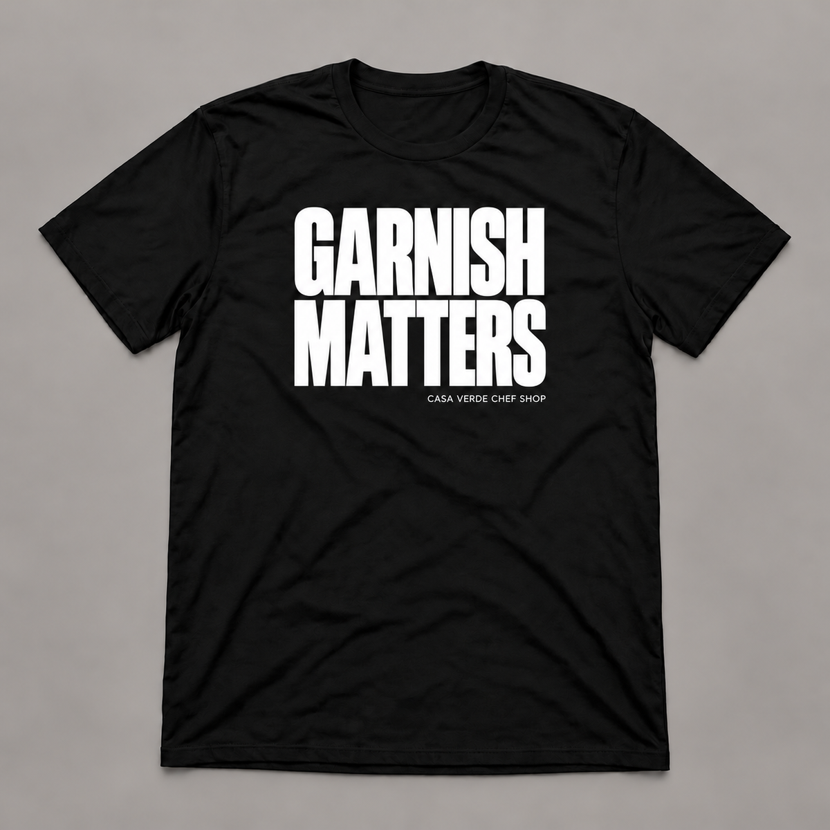 garnish matters T-shirt — shirt-only front. Illustrative design preview; final garment, fit and print placement may vary.