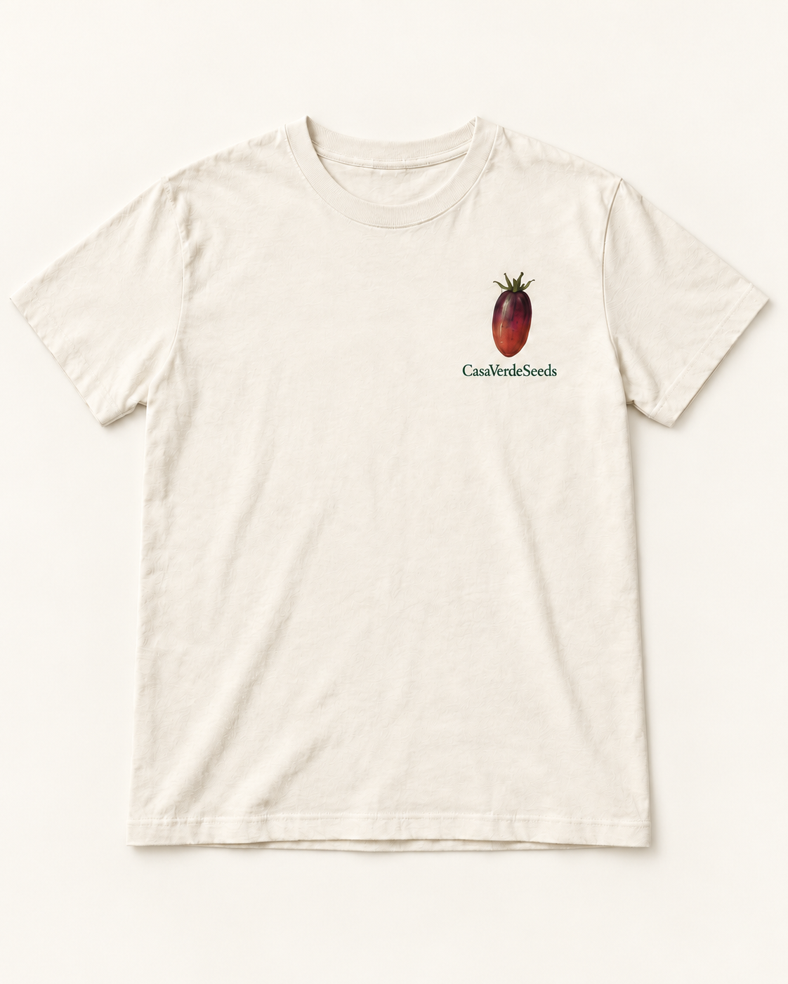 Tomato Obsessed T-Shirt — individual front preview, with a small dark tomato and Casa Verde Seeds signature at the left chest. Illustrative garment preview, not a production master.